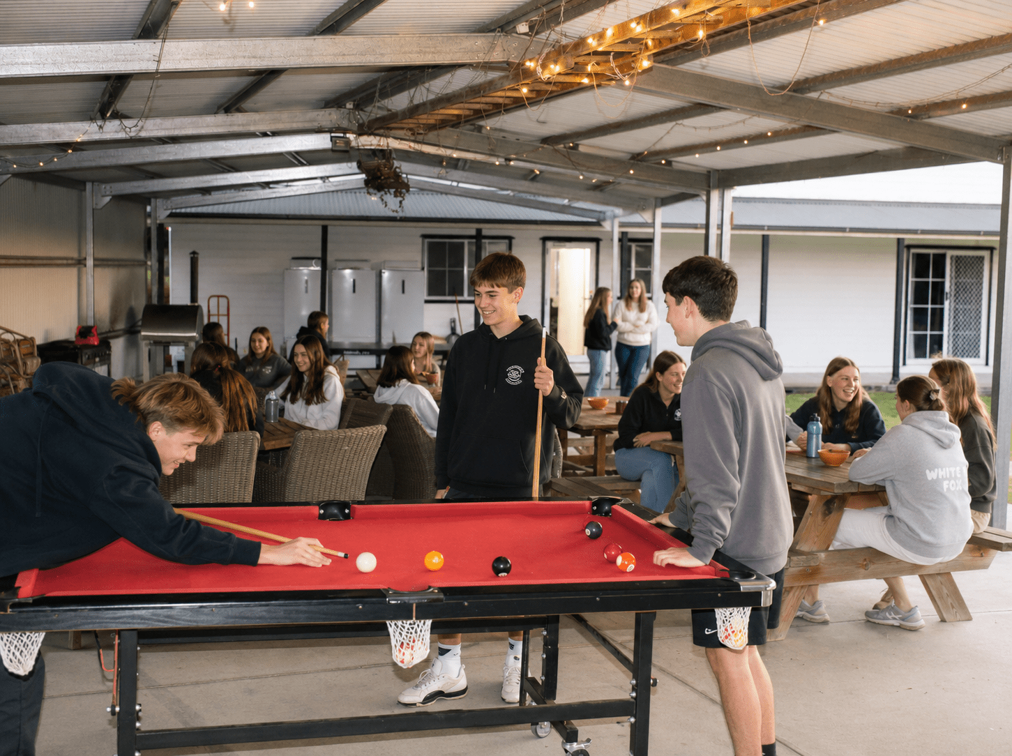 Covered entertaining area with pool table at Berrima Retreat