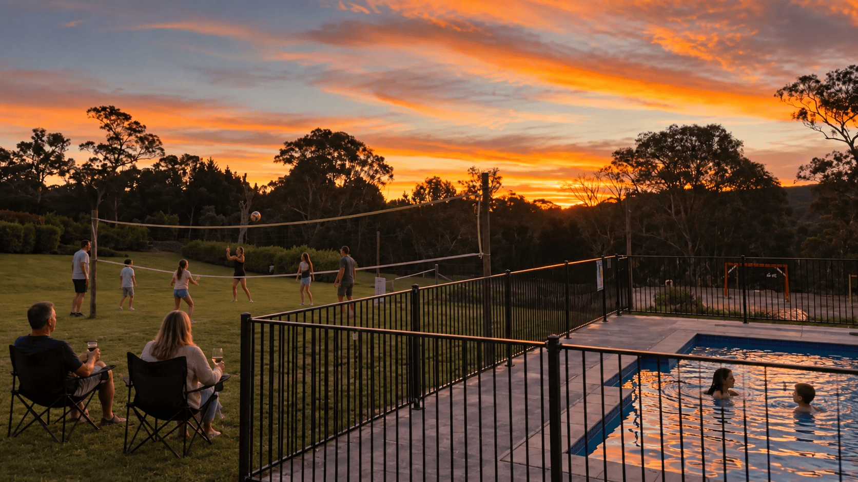 Guests enjoying the swimming pool and volleyball area at Berrima Retreat at sunset